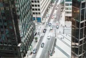 A view of a city street from a tall building.